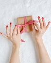 Woman packaging Christmas gift box Royalty Free Stock Photo