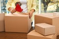 Woman packing box indoors. Moving day