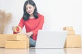 Woman packing boxes