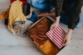 Woman packing clothes into cardboard donation box Royalty Free Stock Photo