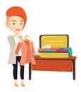 Woman packing his suitcase vector illustration. Royalty Free Stock Photo