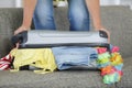 woman packing holiday suitcase Royalty Free Stock Photo