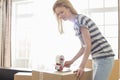 Woman packing moving box at home Royalty Free Stock Photo