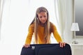 Woman packing suitcase on bed Royalty Free Stock Photo