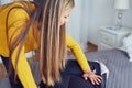 Woman packing suitcase on bed Royalty Free Stock Photo