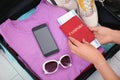 Woman packing suitcase for journey Royalty Free Stock Photo