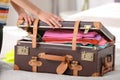 Woman packing suitcase for journey at home Royalty Free Stock Photo