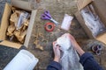 A woman packs a glass cup in a plastic bubble wrap. Fragile package Royalty Free Stock Photo