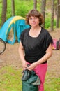 The woman packs tent