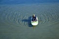 Woman on paddleboard in Dana Point Harbor, California.