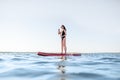 Woman paddleboarding on the lake