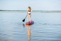 Woman paddleboarding on the lake