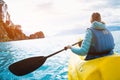 Woman paddles kayak