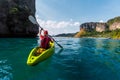 Woman paddles kayak