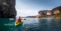 Woman paddles kayak