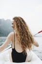 Woman paddling a canoe through a national park Royalty Free Stock Photo