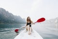 Woman paddling a canoe through a national park Royalty Free Stock Photo