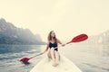 Woman paddling a canoe through a national park Royalty Free Stock Photo