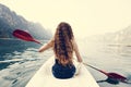 Woman paddling a canoe through a national park Royalty Free Stock Photo