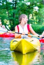 Woman paddling with canoe on river Royalty Free Stock Photo