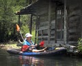 Woman Paddling by Floating Cabin - MorrisonSprings