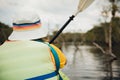 Woman paddling a kayak in the lagoon. Royalty Free Stock Photo