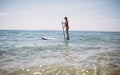 Woman paddling SUP board Royalty Free Stock Photo