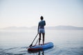 Woman paddling on sup board Royalty Free Stock Photo