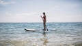 Woman paddling SUP board Royalty Free Stock Photo