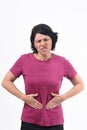 Woman with pain on belly on white background