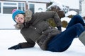 Woman In Pain Falling Over In Snowy On Slippery Street And Injuring Herself Royalty Free Stock Photo