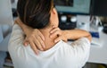 Woman with pain in her neck and shoulder and injury. Health care and medical concept. Royalty Free Stock Photo