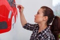 Woman paint little car Royalty Free Stock Photo