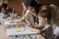 Woman painter lead painting classes for little kids Royalty Free Stock Photo