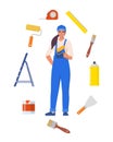 Woman painter in uniform with paint roller. Set of painting tools, brush, roller. Decorator job, interior renovation service. Royalty Free Stock Photo