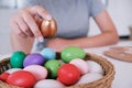 Woman painting Easter eggs at home. family preparing for Easter. Royalty Free Stock Photo