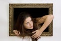 Woman in a painting frame Royalty Free Stock Photo