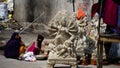 Woman is painting the idol of Durga Mata Royalty Free Stock Photo