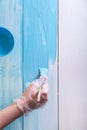 Woman painting with a paint brush wooden boards Royalty Free Stock Photo