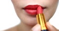 Woman painting a red lipstick, closeup, isolated, abstract, texture, on the white background
