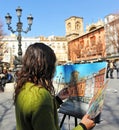 Woman painting in the square of Bib Rambla, Granada, Spain