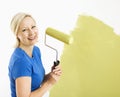 Woman painting wall. Royalty Free Stock Photo