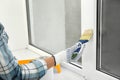 Woman painting window frame at home Royalty Free Stock Photo