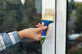 Woman painting window frame at home Royalty Free Stock Photo