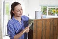 Woman Painting Old Wooden Cabinet At Home Royalty Free Stock Photo