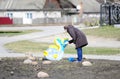 Woman paints a statue of fish