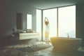 Woman in pajamas in gray bathroom interior Royalty Free Stock Photo