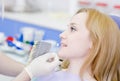 Woman with palette for tooth color