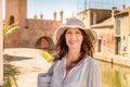 Woman in panama in medieval city Royalty Free Stock Photo