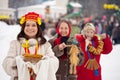 Woman with pancakes during Maslenitsa festival